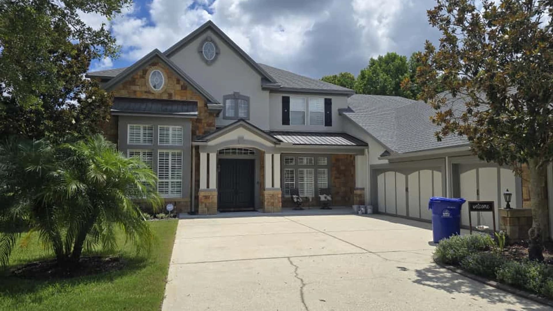 Professional Jacksonville painters finishing an exterior house painting project
