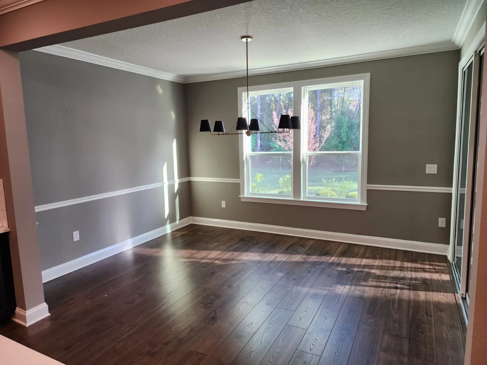 Dining room with fresh gray walls and chair rail